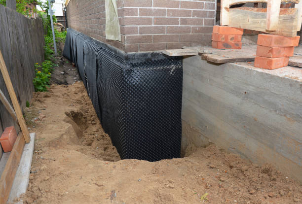 Happy homeowners after waterproofing job in Pleasant Hill